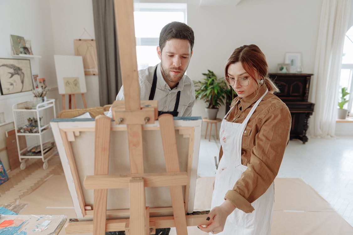 Woman Standing Beside the Man Painting · Free Stock Photo