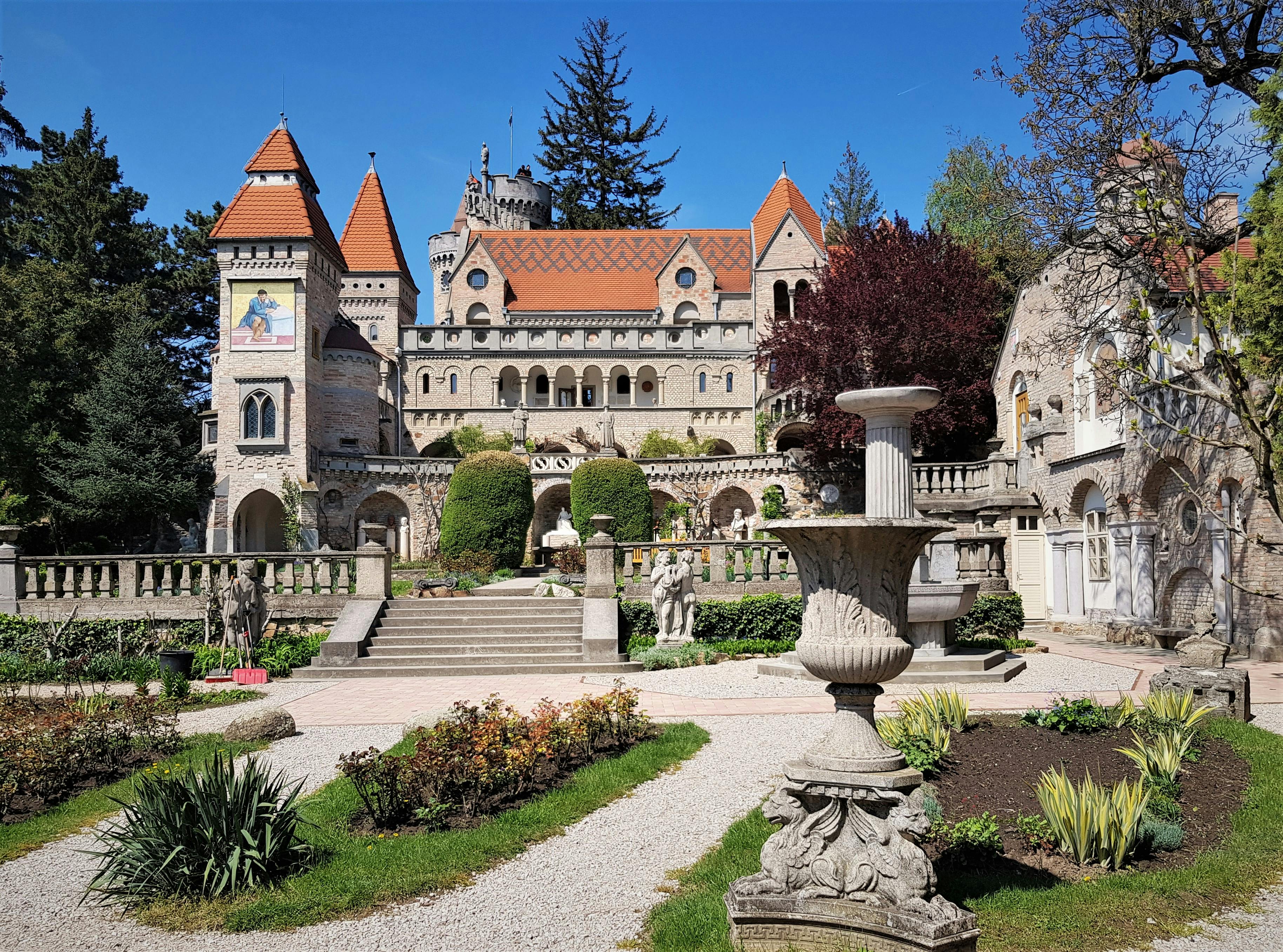Explore the enchanting Bory Castle in Hungary, surrounded by lush gardens and rich history.