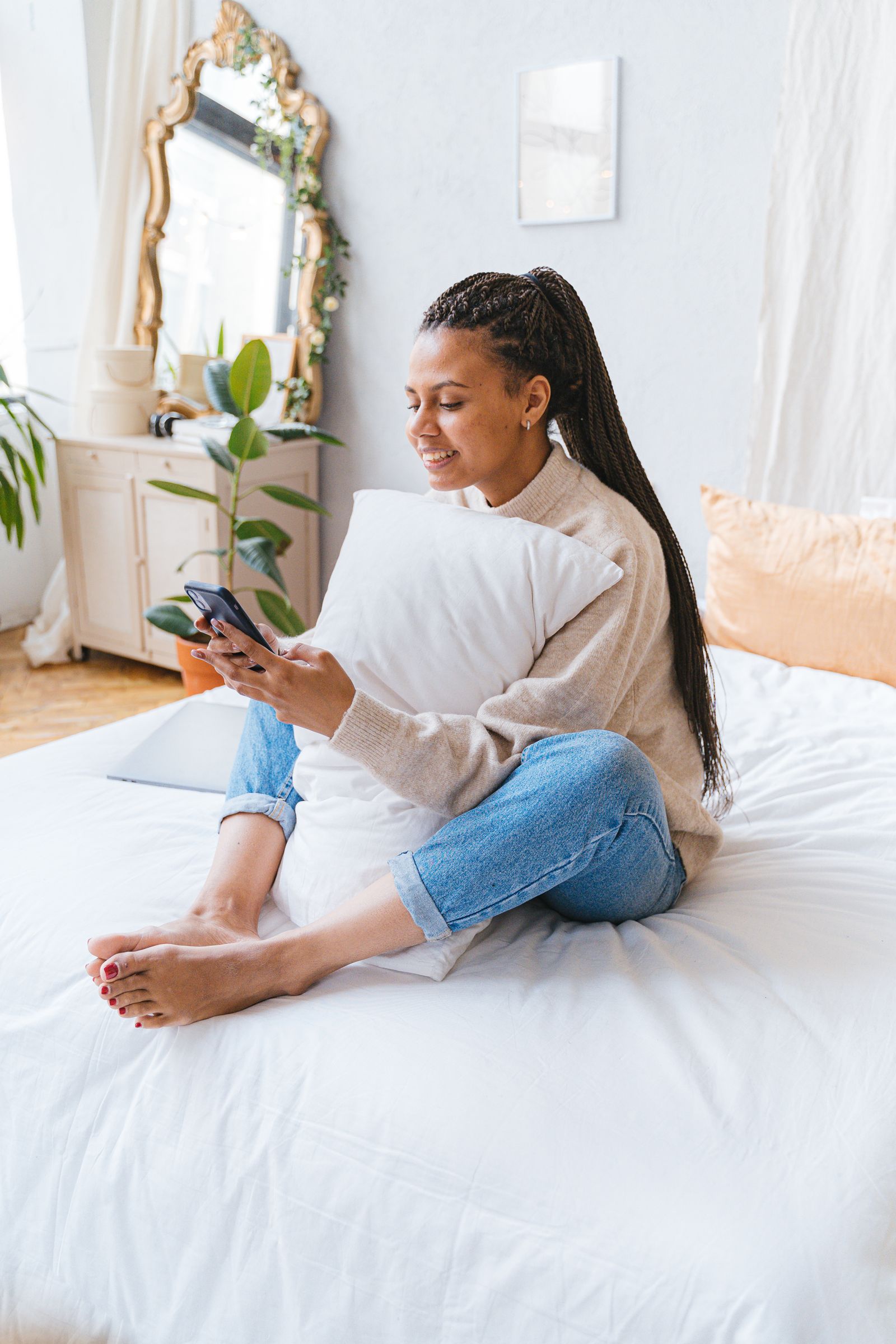 African guest using a smartphone while confirming accommodation details