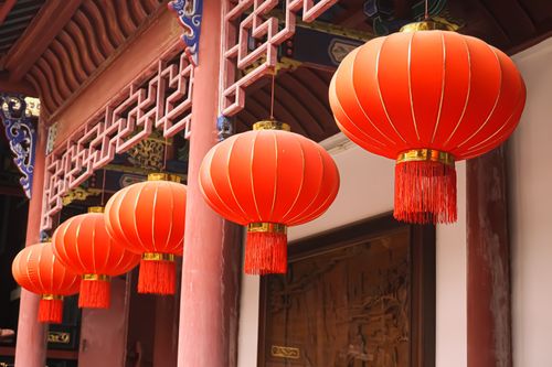 Free Traditional red Chinese lanterns hanging in a row, showcasing cultural decor. Stock Photo
