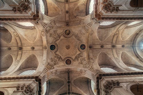 Free A Concrete Ceiling with Arches and Paintings of Saint Sulpice Church Stock Photo