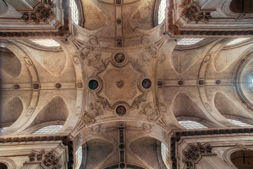 Free A captivating view of the ornate ceiling in Saint Sulpice Church, Paris. Stock Photo