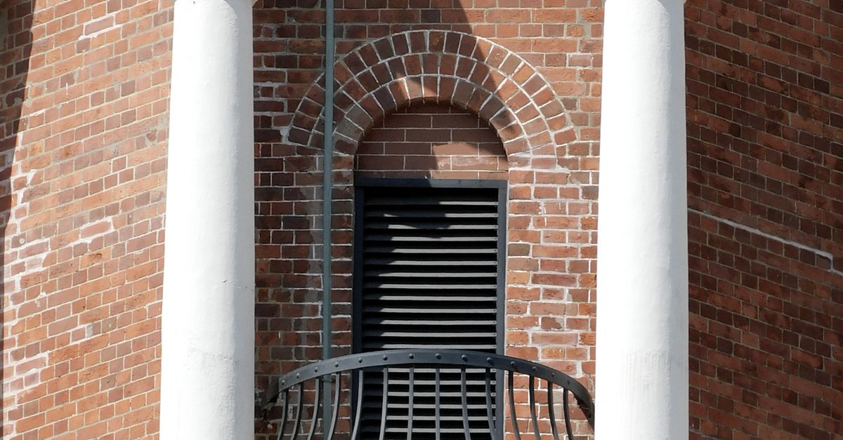 Brick Column Railing Brick building facade with columns and railing · Free Stock Photo