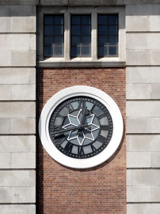 Building exterior with clock and windows · Free Stock Photo