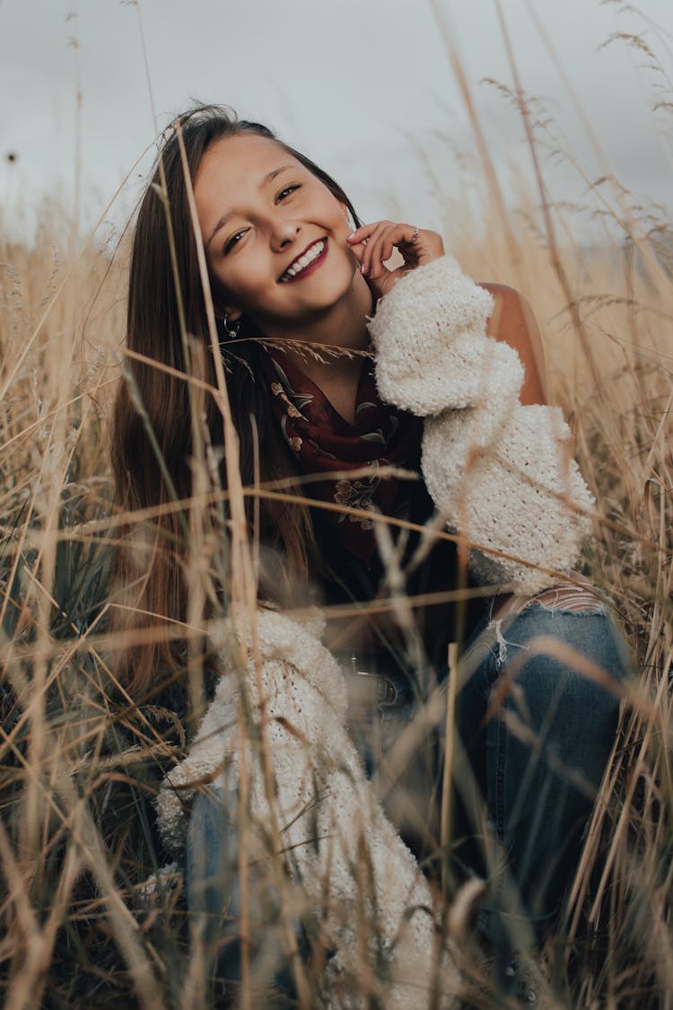 Smiling Woman Wearing Red Floral Neck Scarf 