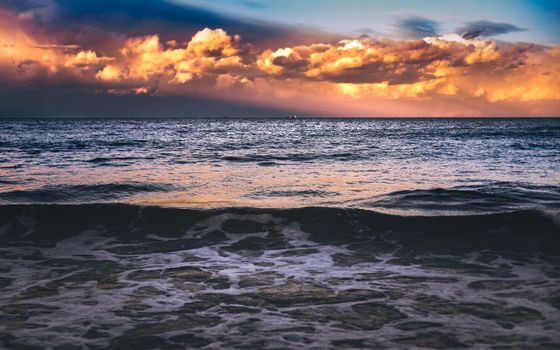 Vivid sunset clouds over the tranquil Baltic Sea at Gdańsk, Poland.
