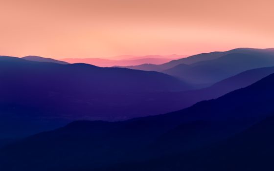 Breathtaking twilight view of Podkarpackie Voivodeship's mountain range with vivid hues