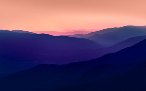 Free Breathtaking twilight view of Podkarpackie Voivodeship's mountain range with vivid hues Stock Photo