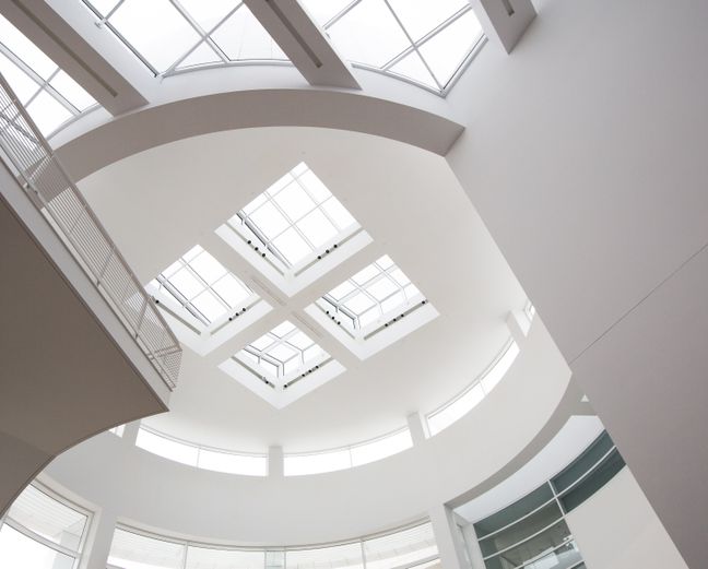 Curved museum gallery with skylight