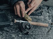 Person Holding Brown Wooden Handle
