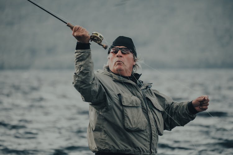 A Man Casting His Fishing Rod
