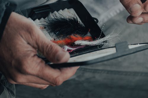 Close-up Photo of Spinners in a Small Black Container 