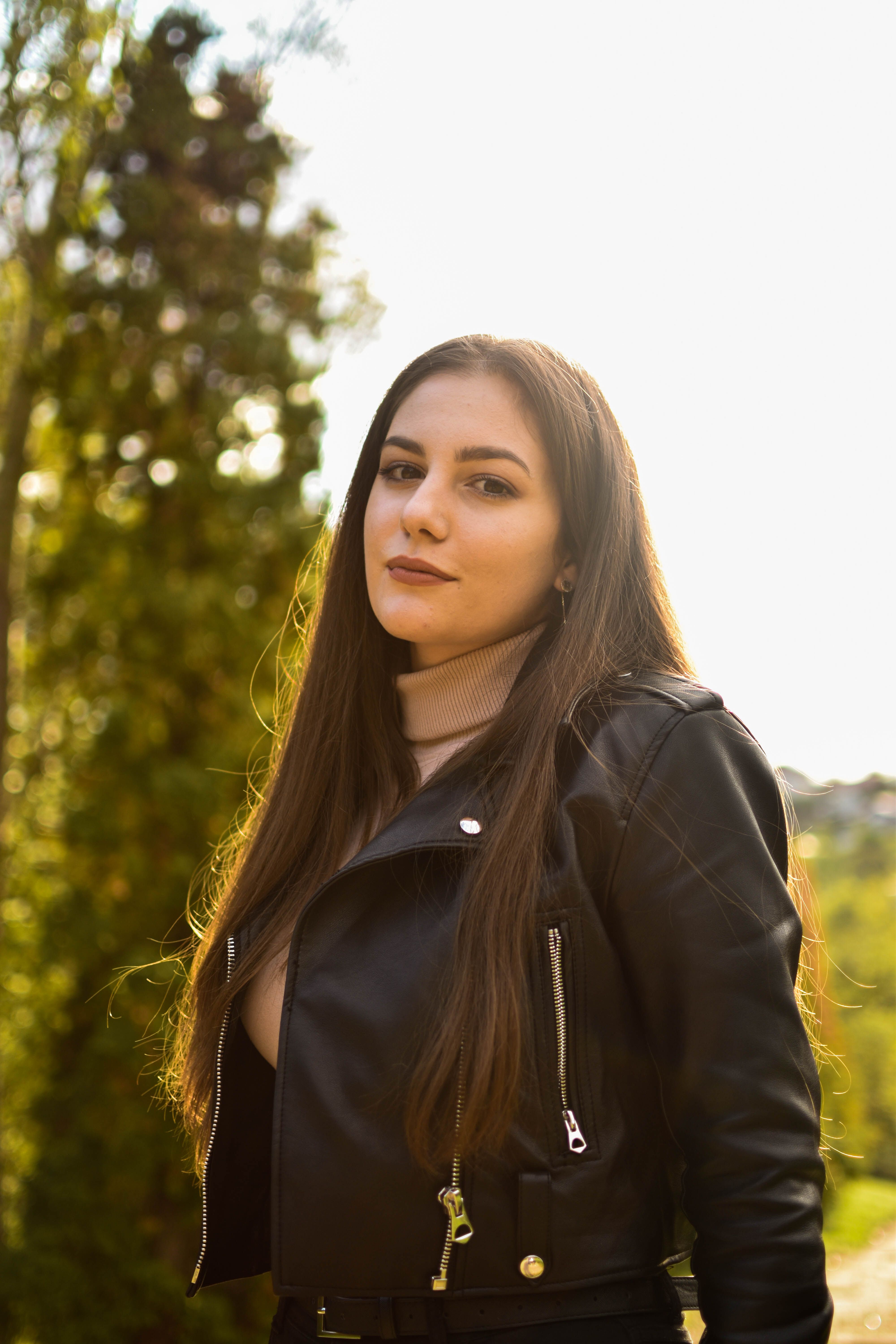 Portrait of Woman Outdoors in Leather Jacket · Free Stock Photo