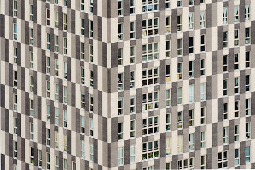 White and Gray Concrete Building with Glass Windows 