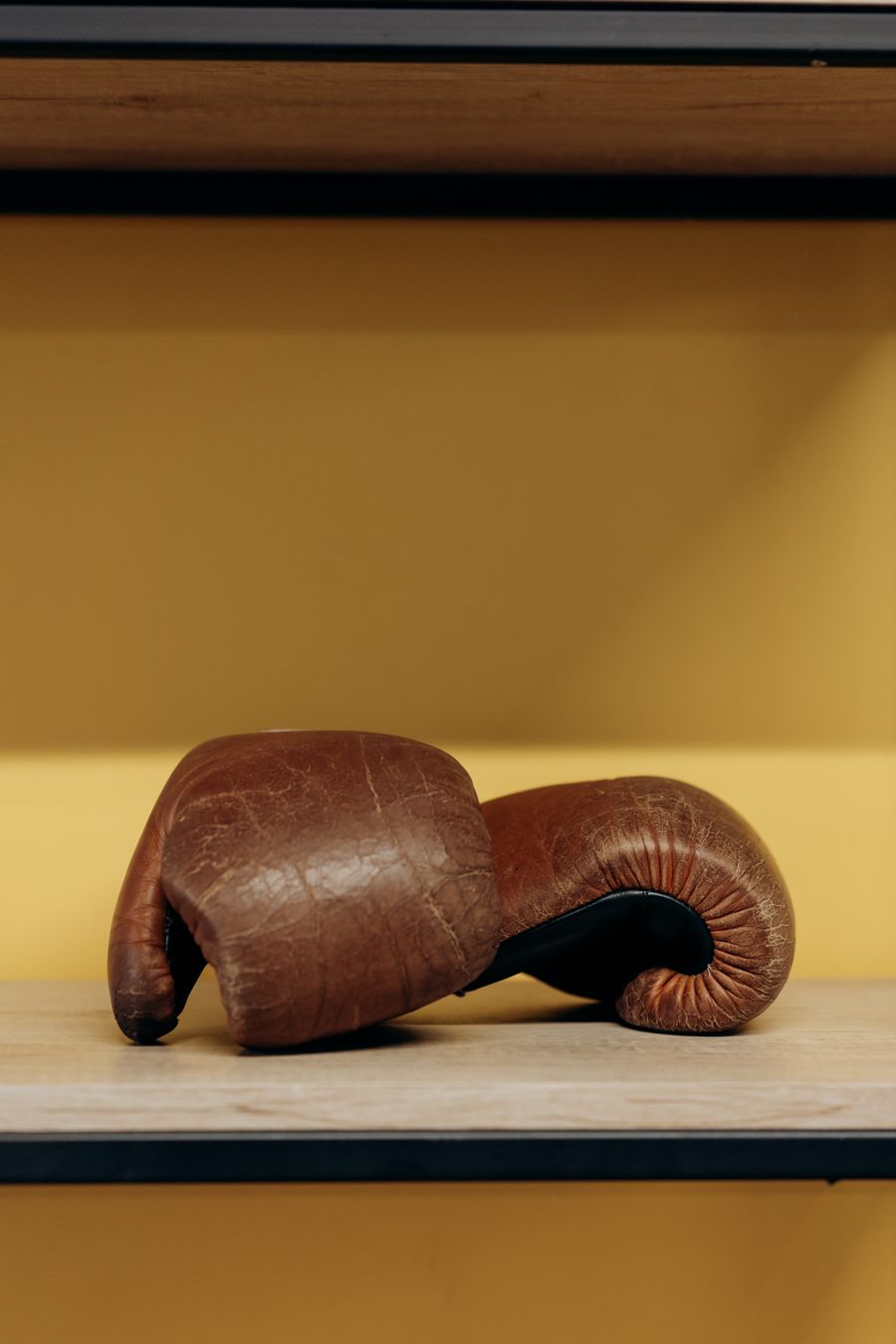 Pair of worn leather training gloves