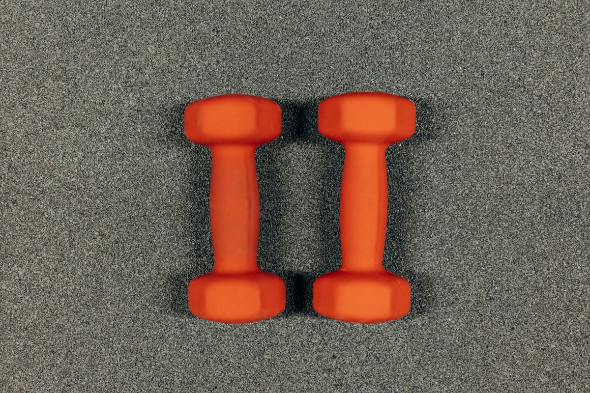 Pair of orange dumbbells