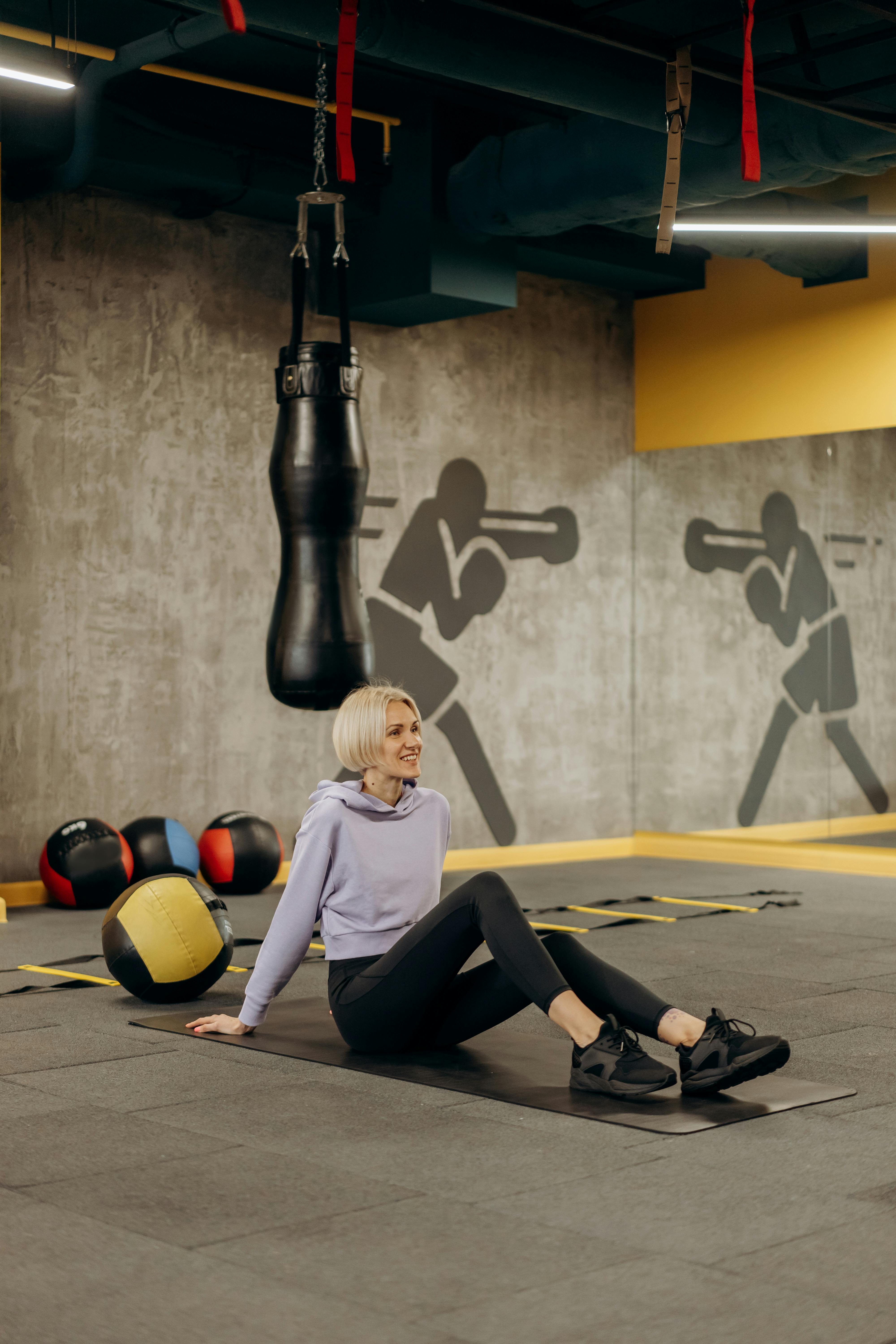 woman sitting on a mat