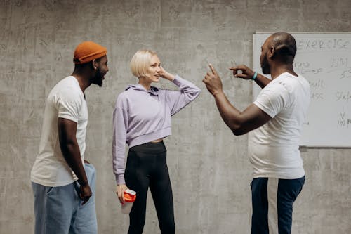 Two Men And Woman Having Conversation