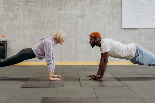Free Man And Woman Doing Push Up Stock Photo
