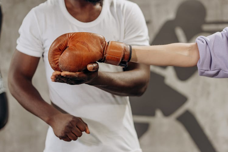 Man Training A Woman To Punch