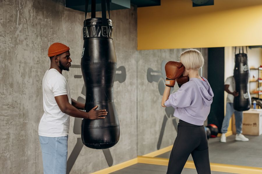 Woman training boxing one-on-one with a coach