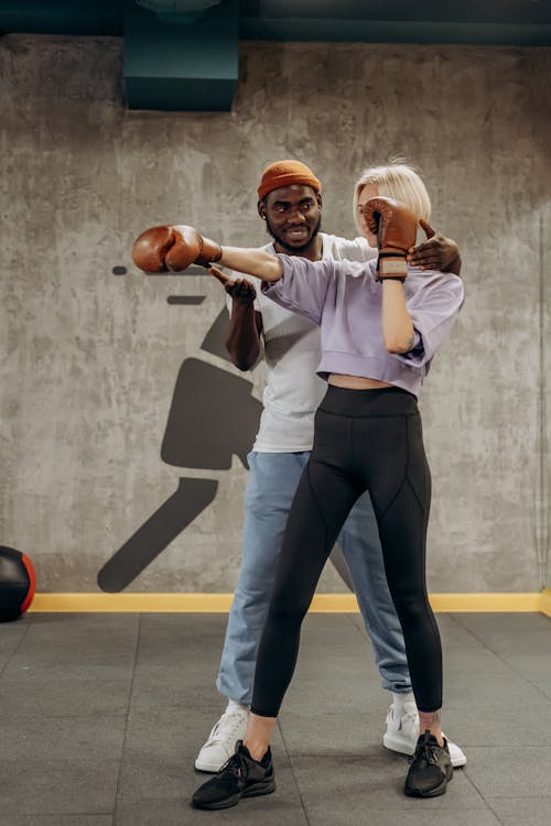 Man Training A Woman To Punch