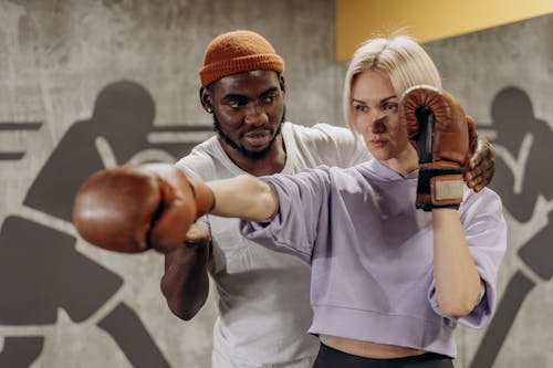Woman Being Trained In Boxing