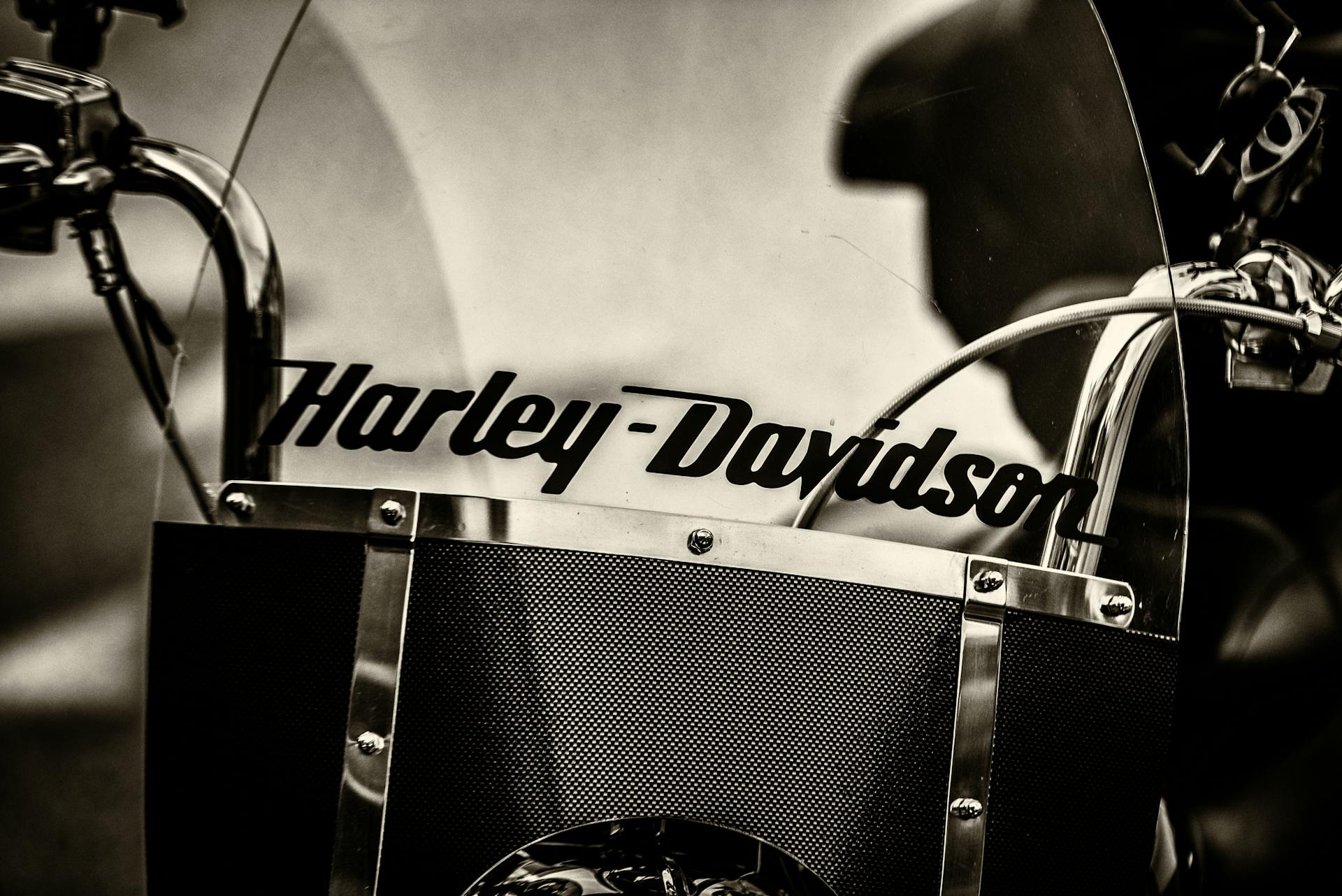 Close-up of a vintage Harley-Davidson motorcycle in black and white.