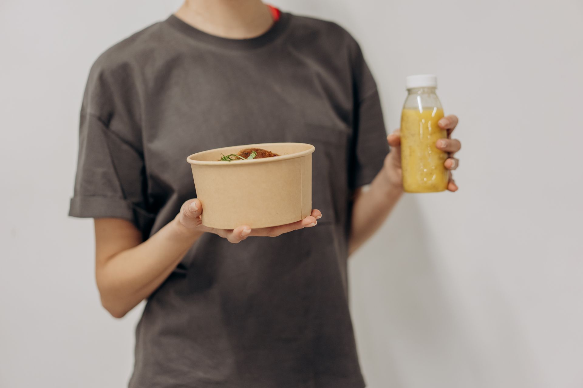 Woman Holding Food And Drink