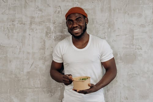Free Man Eating On A Rice Bowl Stock Photo