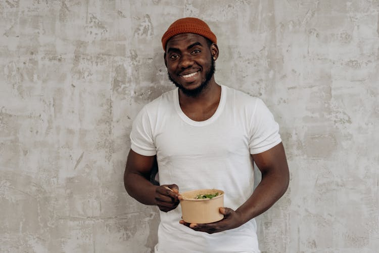 Man Eating On A Rice Bowl