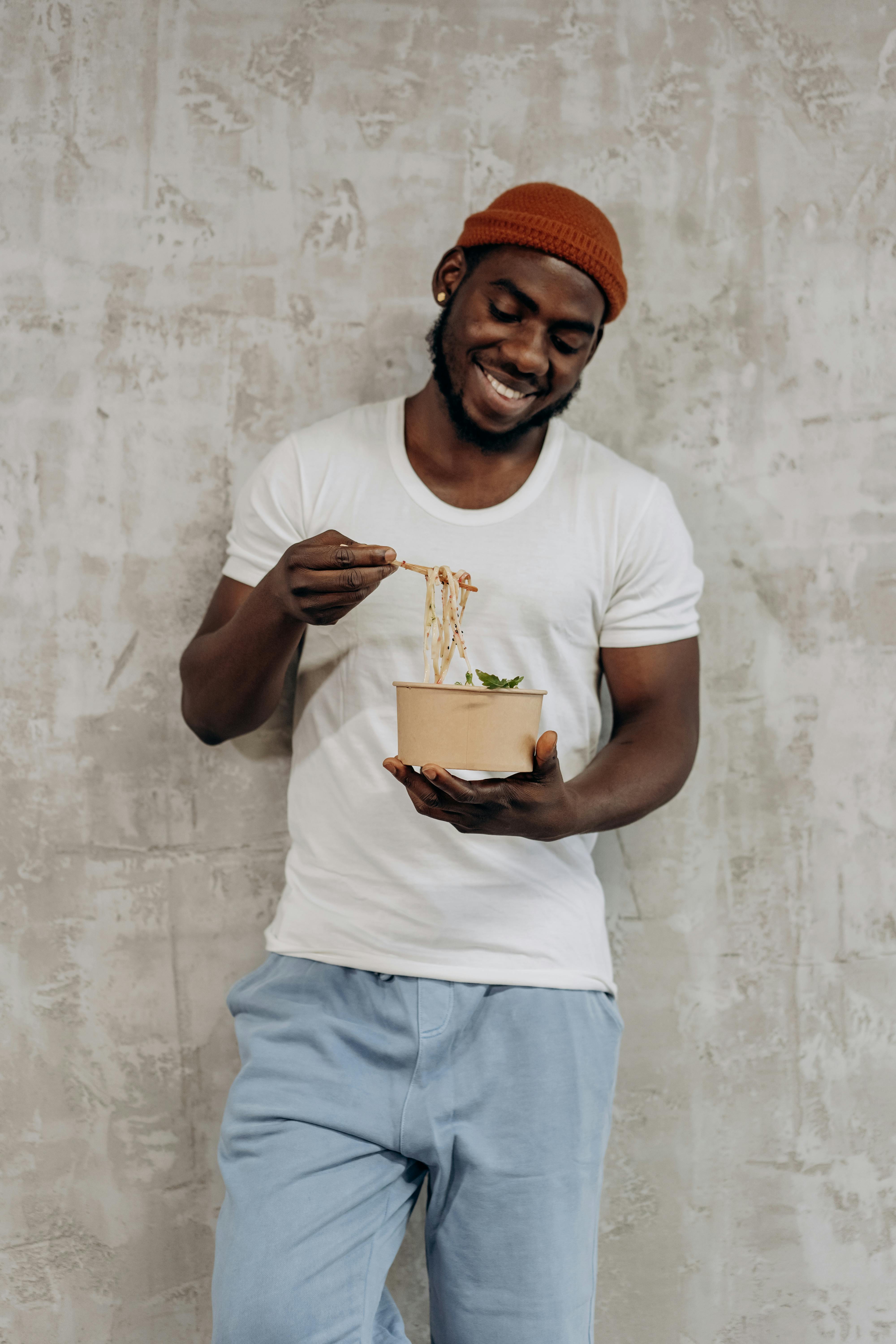 man eating with chopsticks