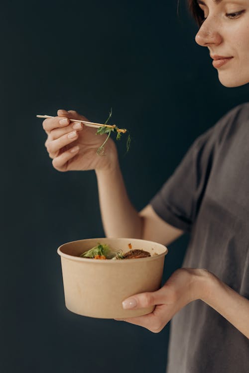 Free Woman Eating With Chopsticks Stock Photo