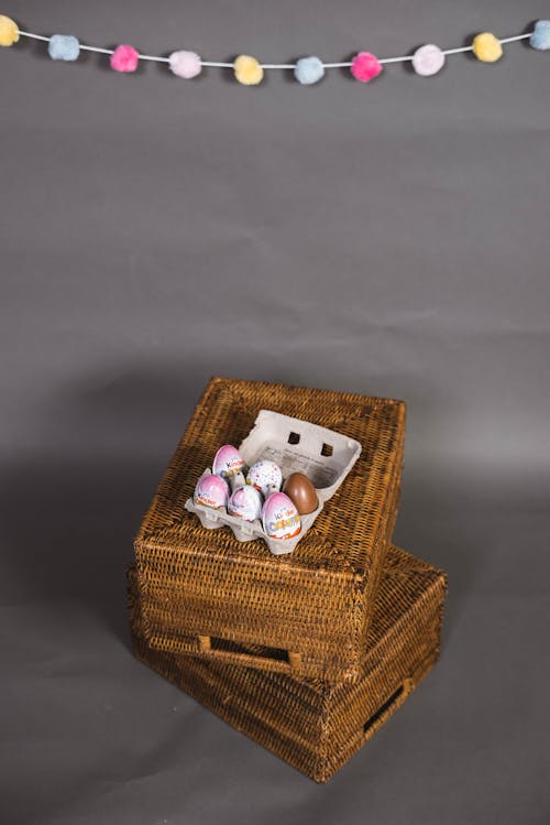 Easter Eggs in a Carton on Top of Woven Baskets