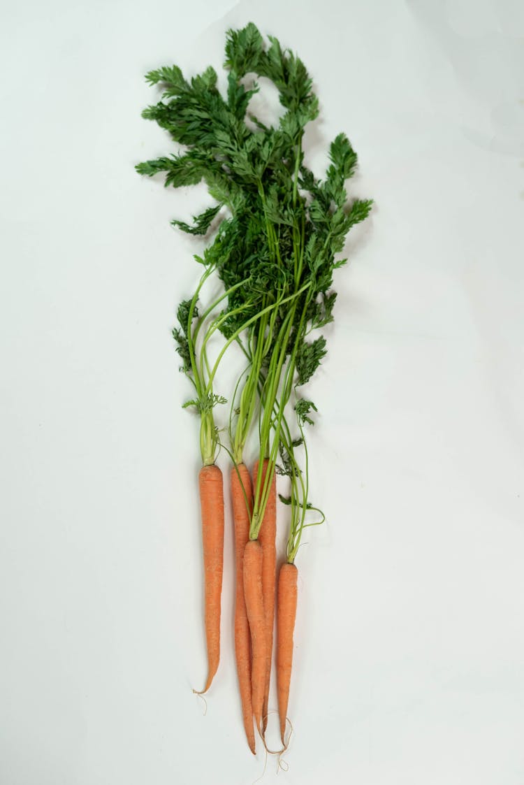 Bunch Of Carrots On White Table