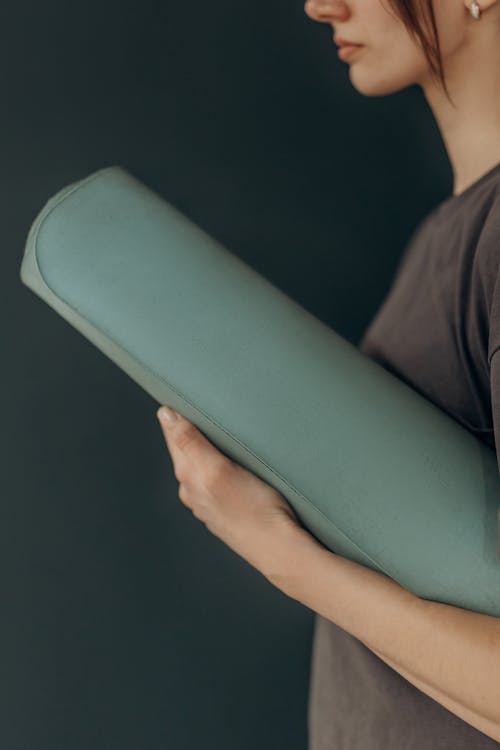 Woman Holding A Yoga Mat