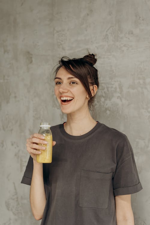 Woman Holding A Juice Drink
