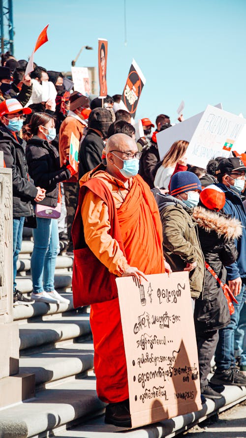 Free People and Monk on Demonstration Stock Photo