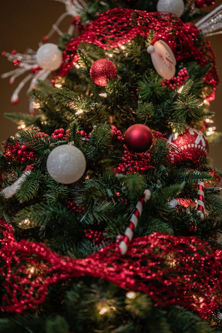 Red And Silver Baubles On Green Christmas Tree