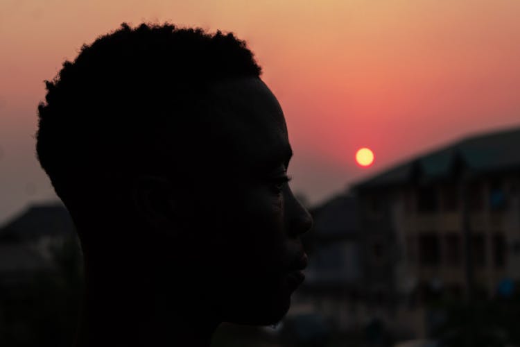 Silhouette Of Man Head At Sunset