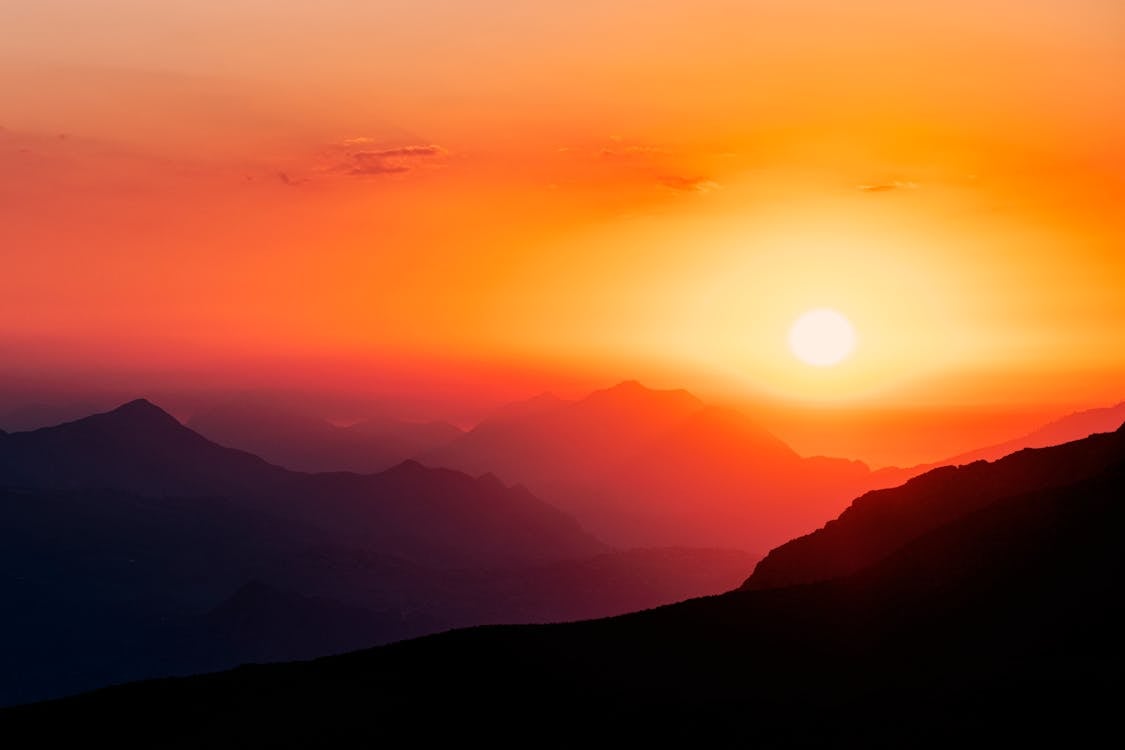 Silhouette of Mountains during Sunset · Free Stock Photo