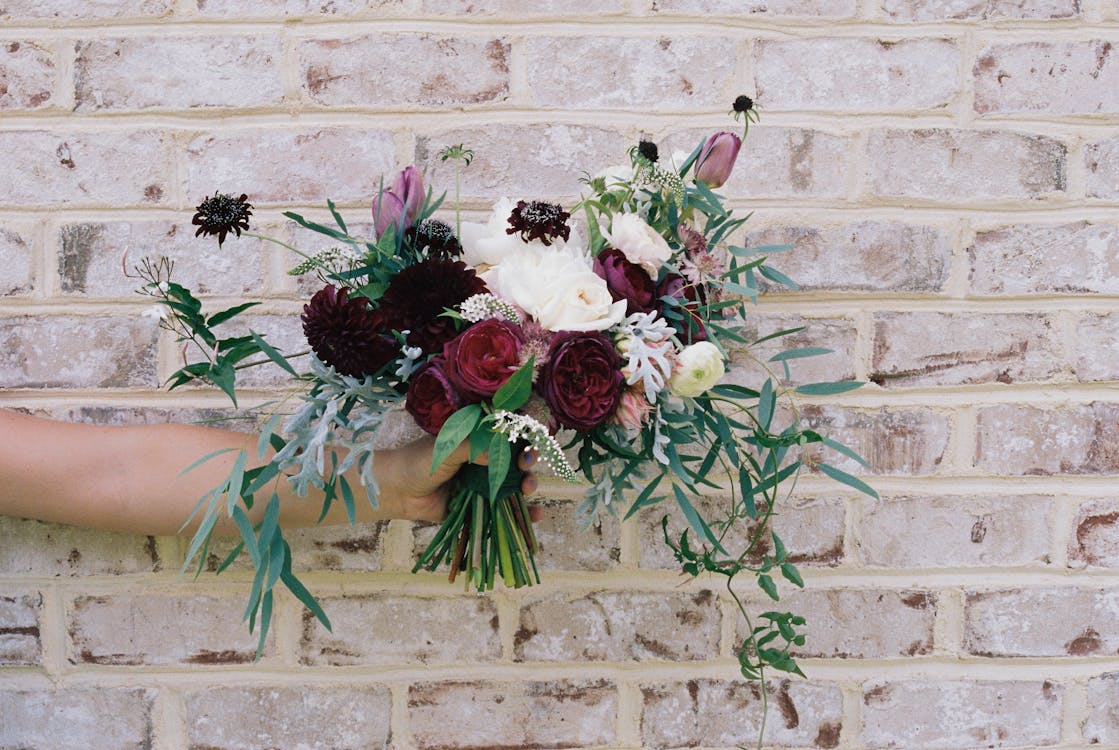 Person Holding Assorted-color Flower Bouquet