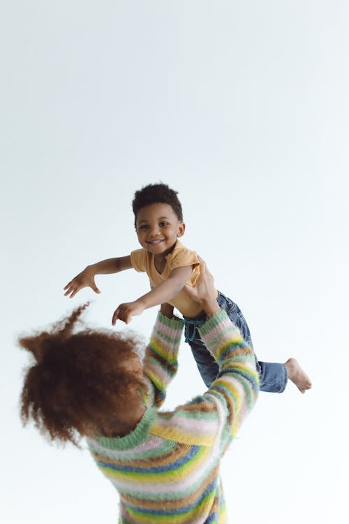 Free Mother carrying her Child Up High Stock Photo