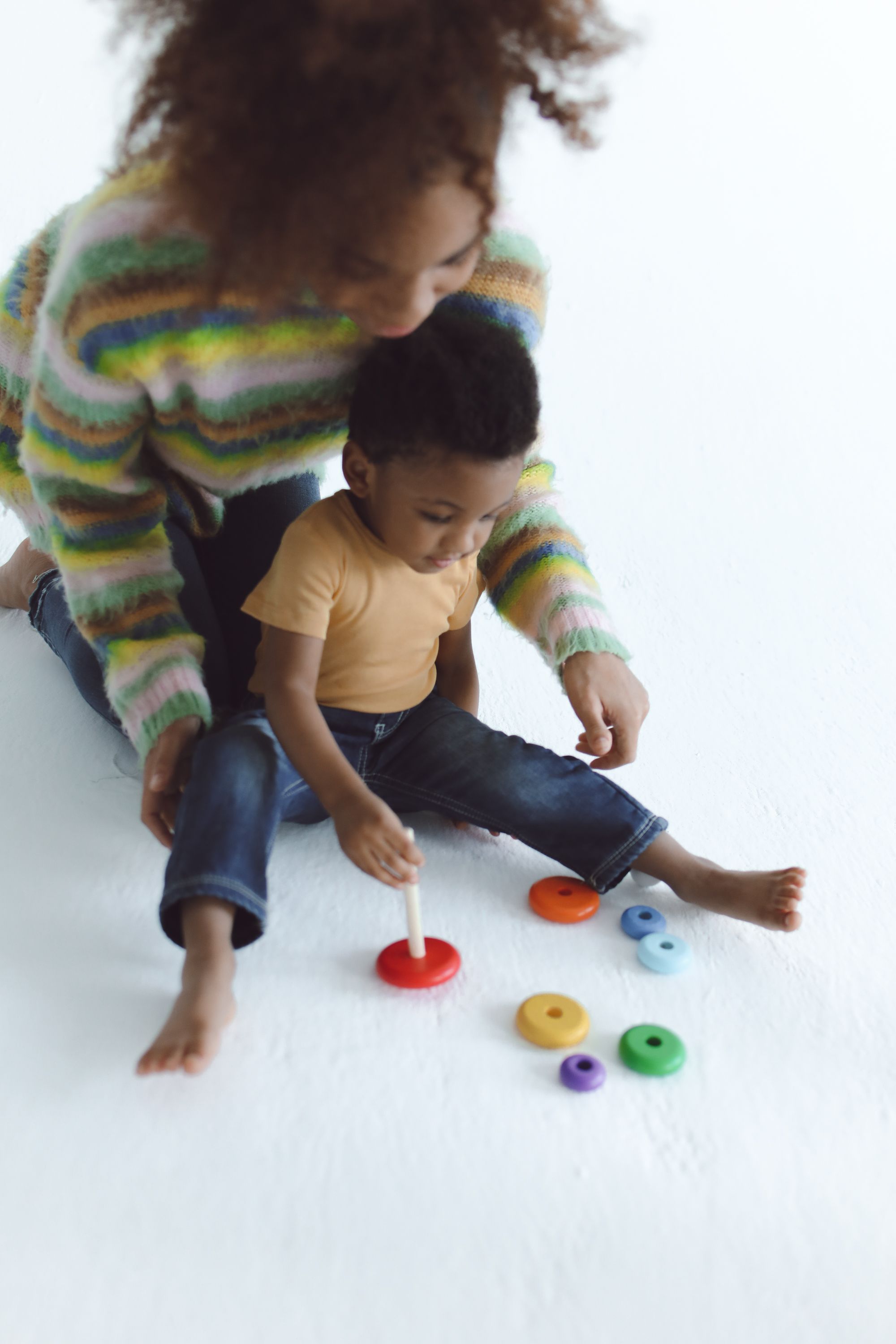 A mother and child enjoying playtime together at home