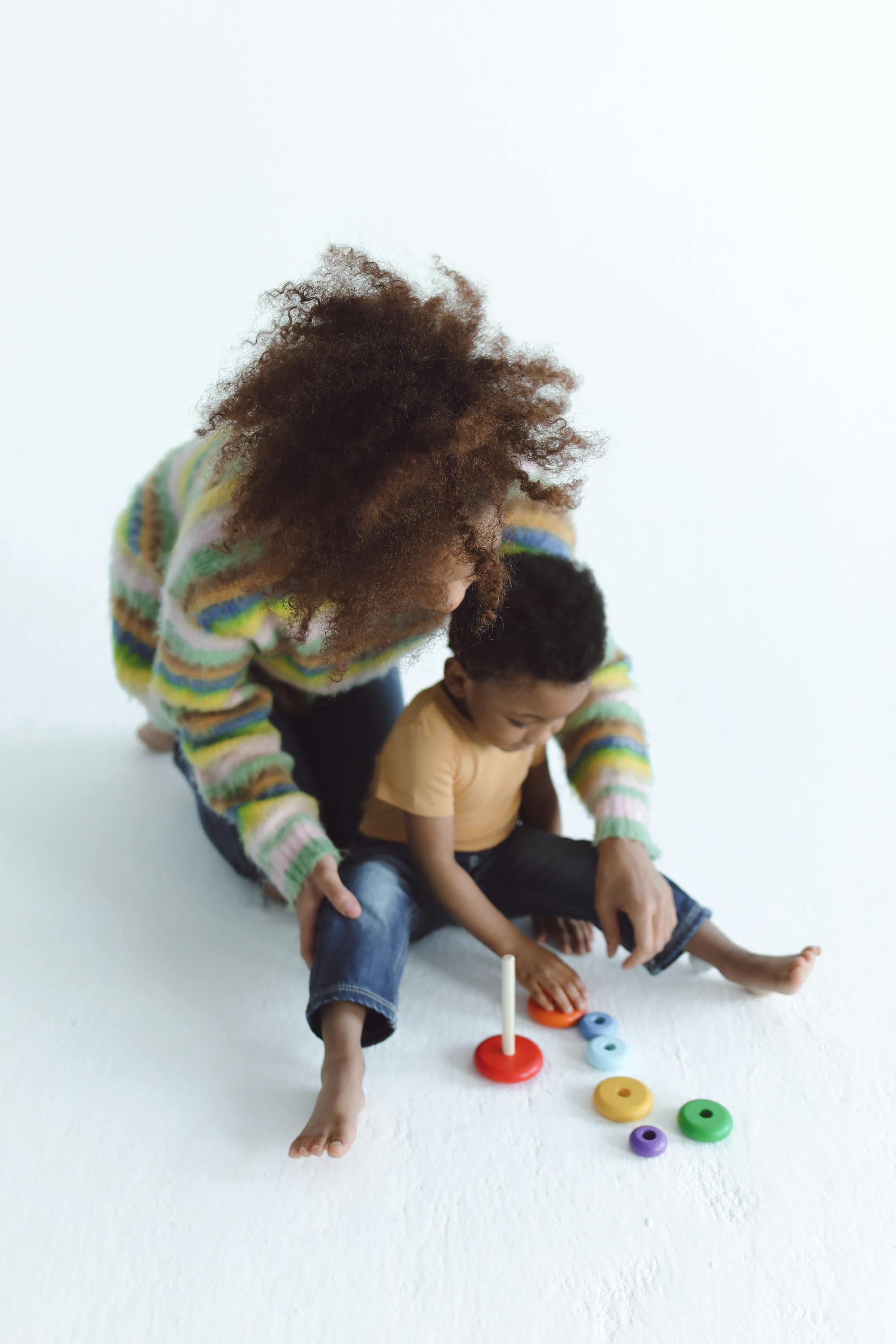 A n Adult Playing Toys with a Kid Free Stock Photo