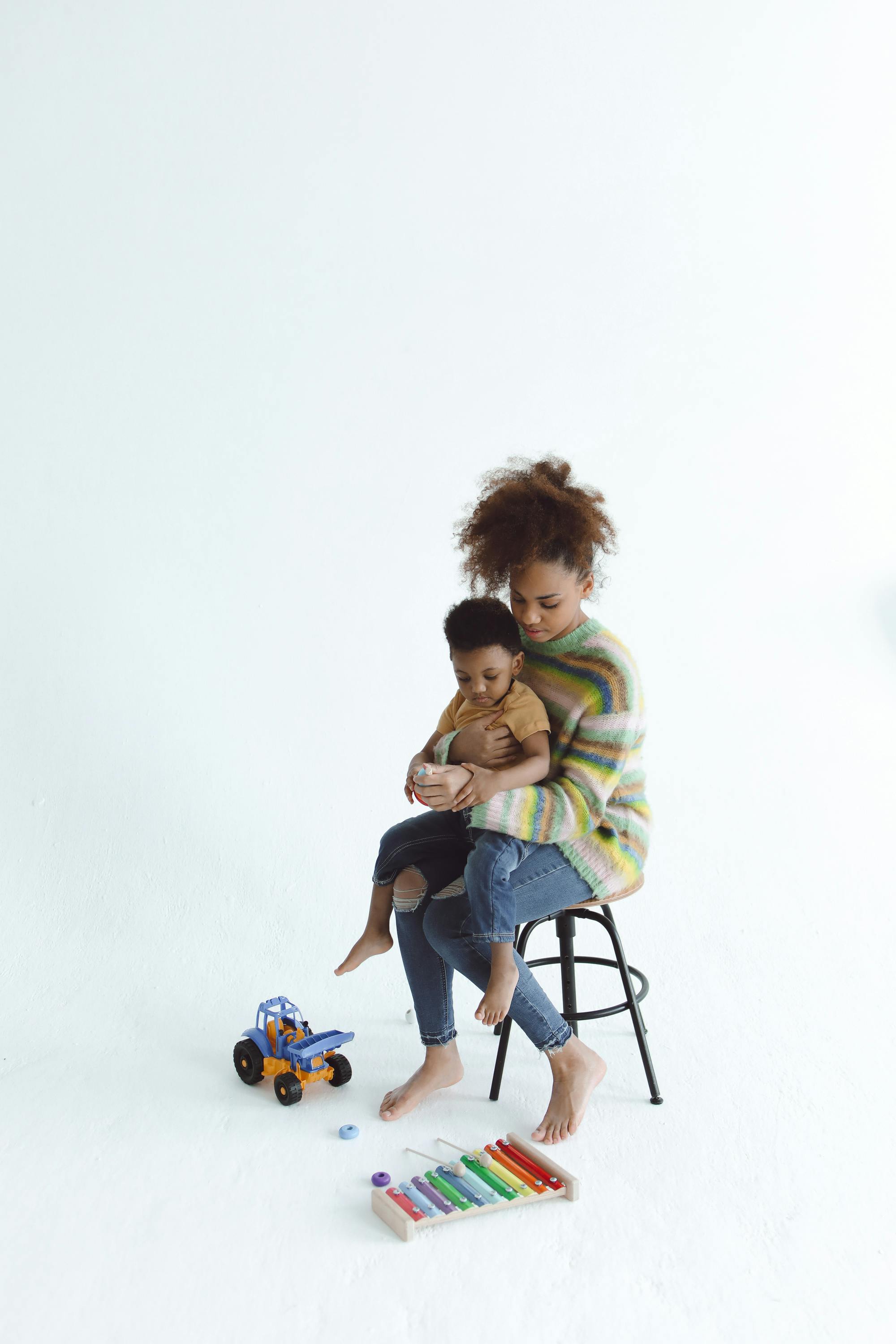 woman sitting on a chair with a child on her lap