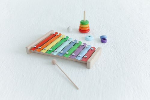 Free Vibrant xylophone and stacking toys on a white background, ideal for educational and fun themes. Stock Photo