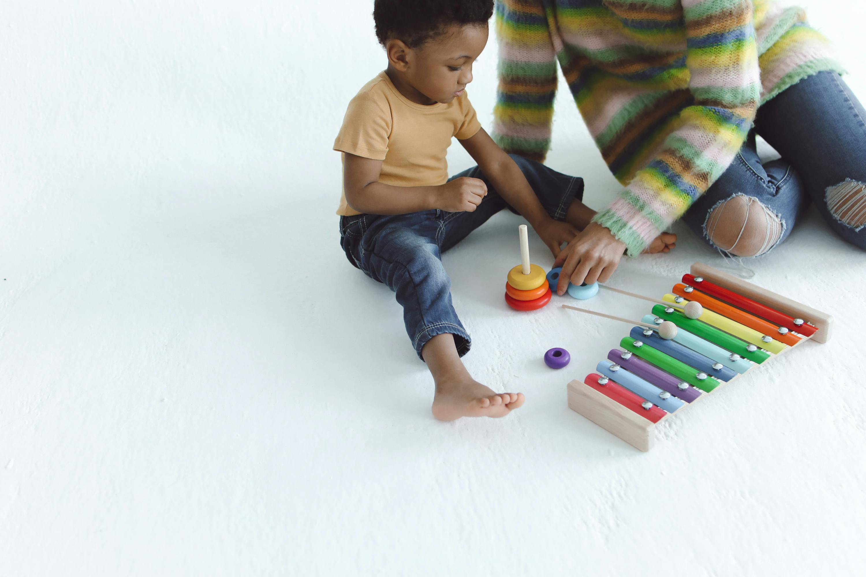 A n Adult Playing Toys with a Kid Free Stock Photo