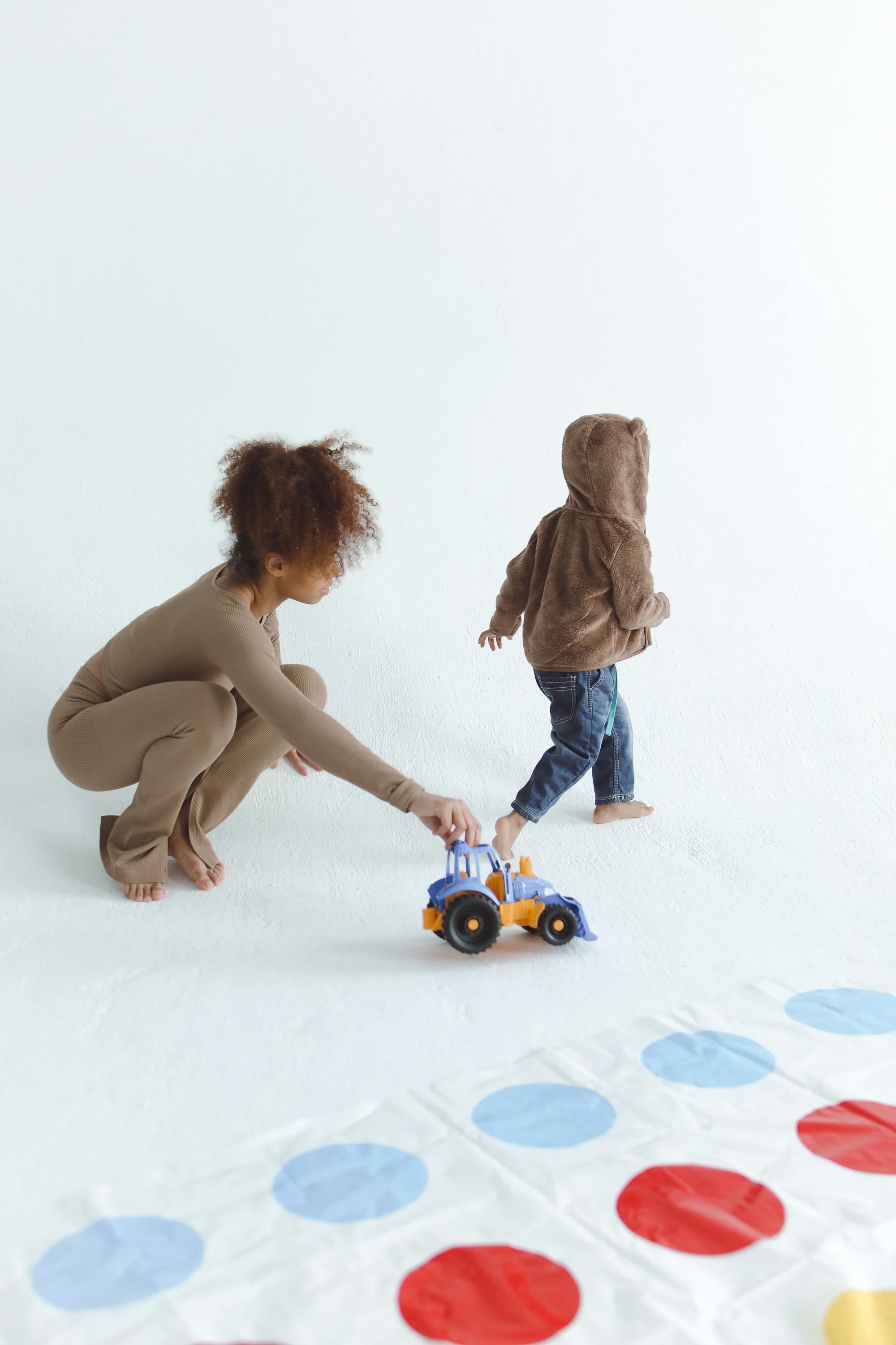 A n Adult Playing Toys with a Kid Free Stock Photo