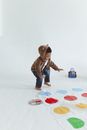 Cute Child in front of Twister Mat